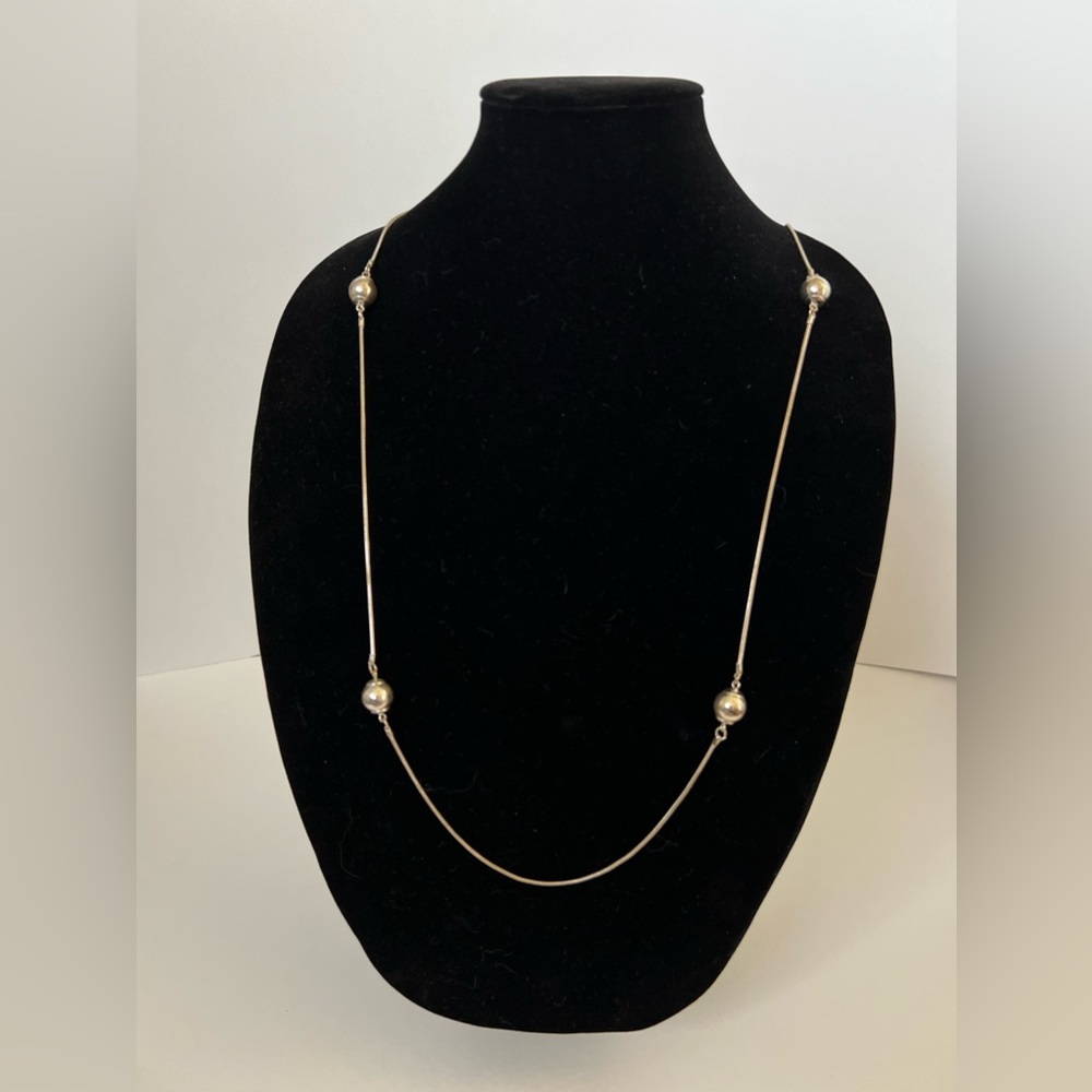 Long Silver Necklace with Silver Beads.